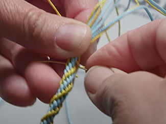 An image that shows a shot of finishing kumihimo