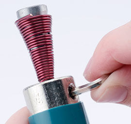 Using an Allen wrench to loosen the mandrel