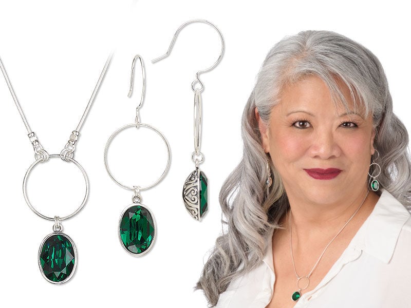 Model wearing a necklace and earrings green preciosa fancy stones in setting