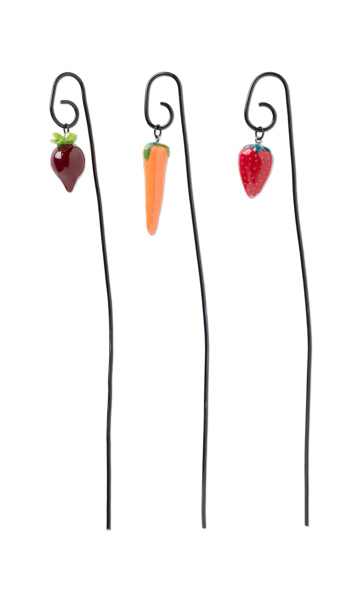 Design Idea R H 7 2 - A polymer clay harvest—a strawberry, a beet and a carrot—hang from three black plants stakes.