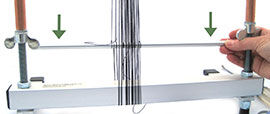 Step 20 - Pulling he warping bar down for even tension