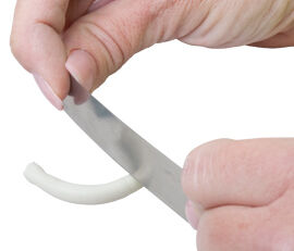 Clay tube being cut