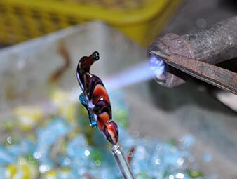 Glass seahorse being torched