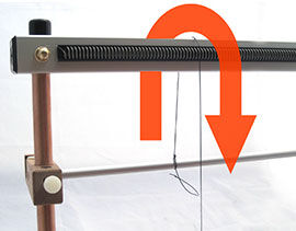 Step 6 - Looping the warping thread over the top bar of loom