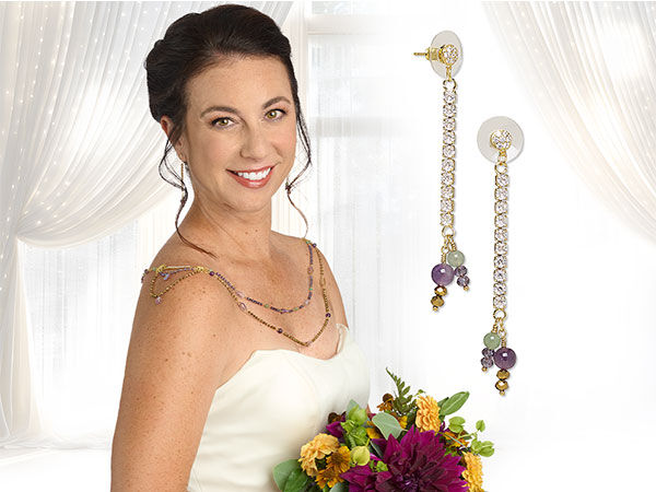 model wearing a wedding dress with bridal jewelry