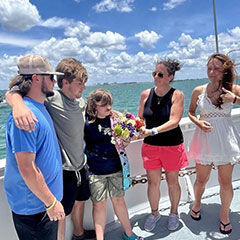 five people on a boat