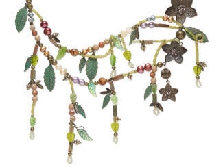 Design Idea M H 3 Z - Multistrand necklace has a conglomeration of beads&mdash;leaves in various shades of green, coppery flowers, pearls and more.