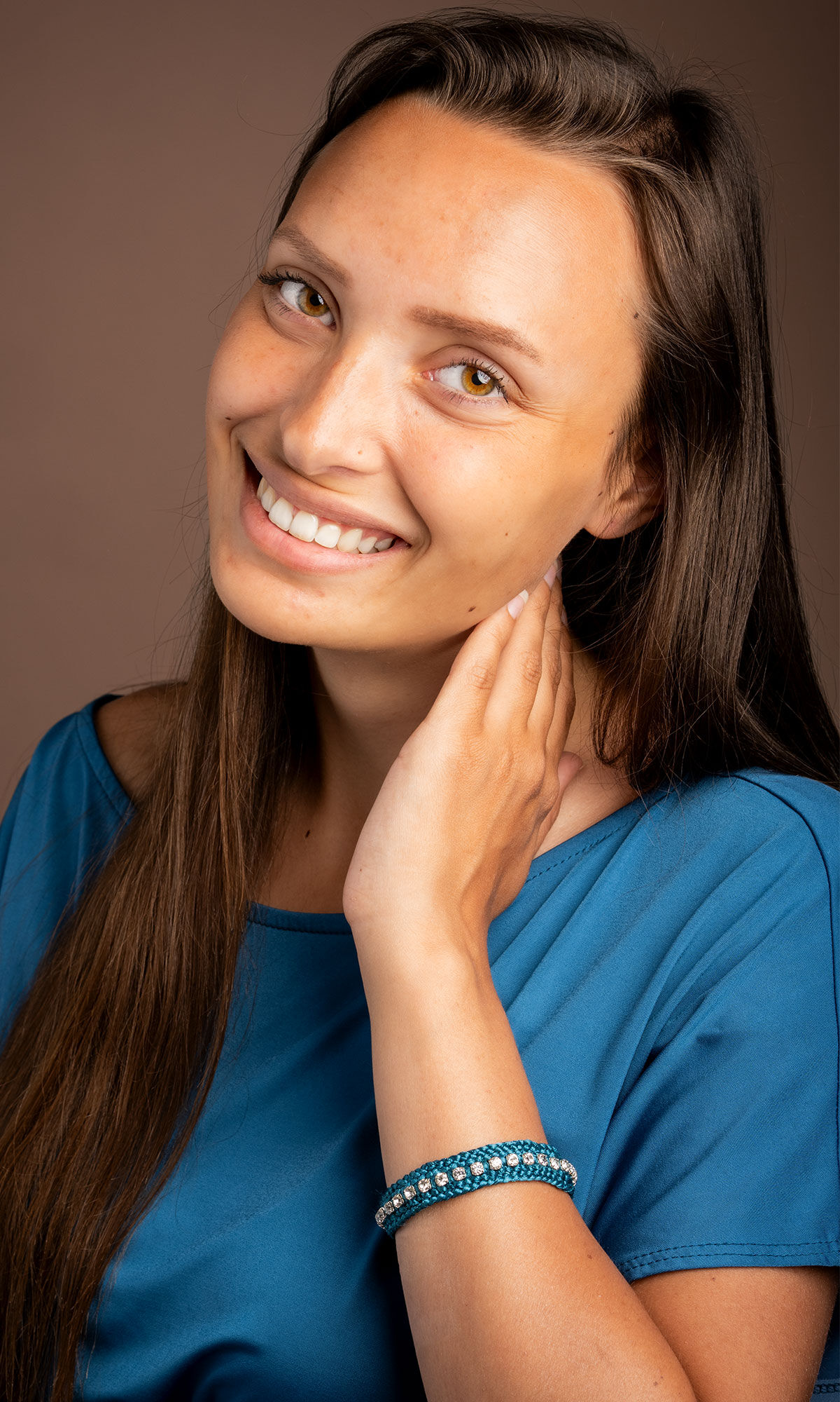 model with a blue top wearing Design Idea R C 3 F Kumihimo 12-Strand Braid with Cupchain