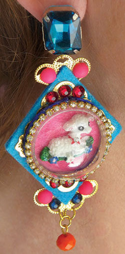 Close up of an earring on a model