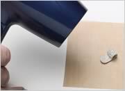 using a hot air dryer on the piece