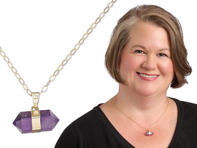 Image of a model wearing a necklace with pendant