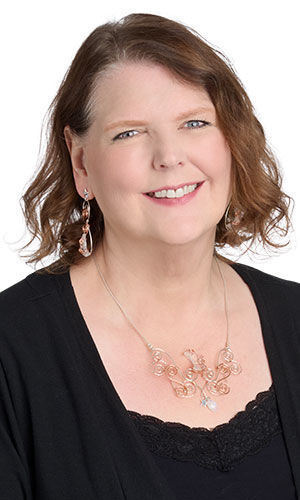 Model in a black blouse wearing design idea R N 2 F