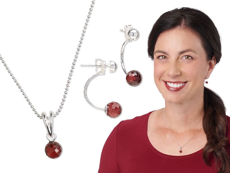 A model wearing red attire and earrings made with red half drilled beads