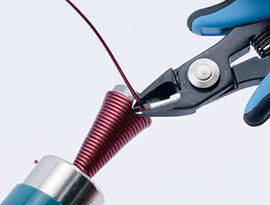 Cutting off the excess wire with cutters