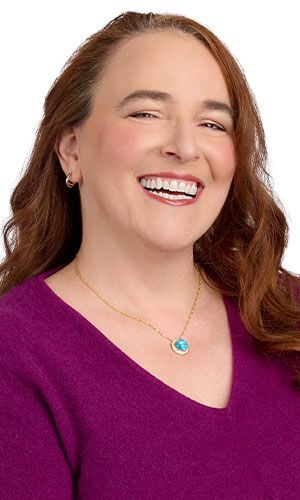 model with a magenta sweater wearing Design Idea R E 3 U three piece Necklace set with Mottled turquoise sculpey clay and wire work pendants and gold finished chain