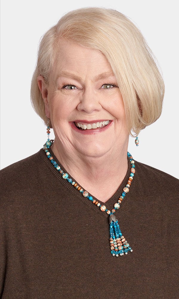 Model wearing a strung necklace 