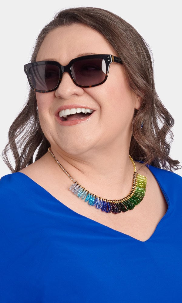 Model showing off a earrings created with seed beads