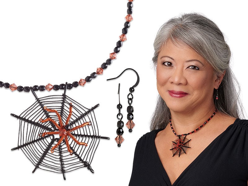 Model wearing a necklace with a handmade spiders web as a pendant