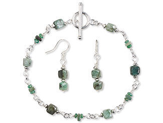 An image of a bracelet and earrings with emerald cube beads