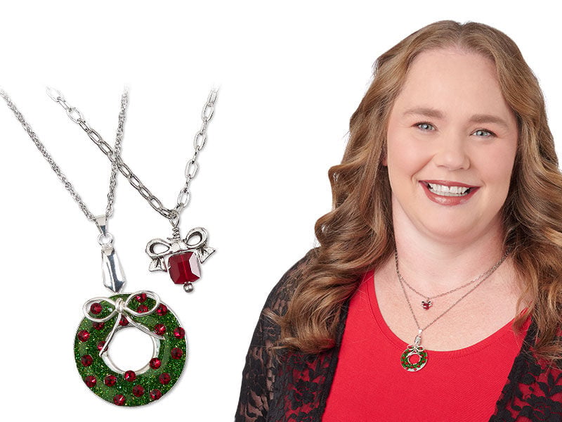 Model wearing necklaces that are christmas themed