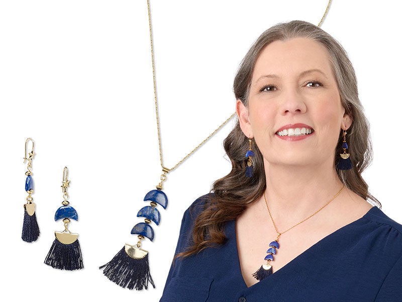 Model wearing a necklace and earrings made with gemstone beads
