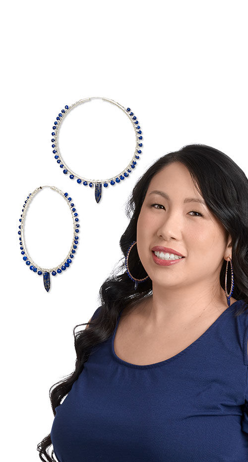 Model wearing hoop earrings made with lapis lazuli beads