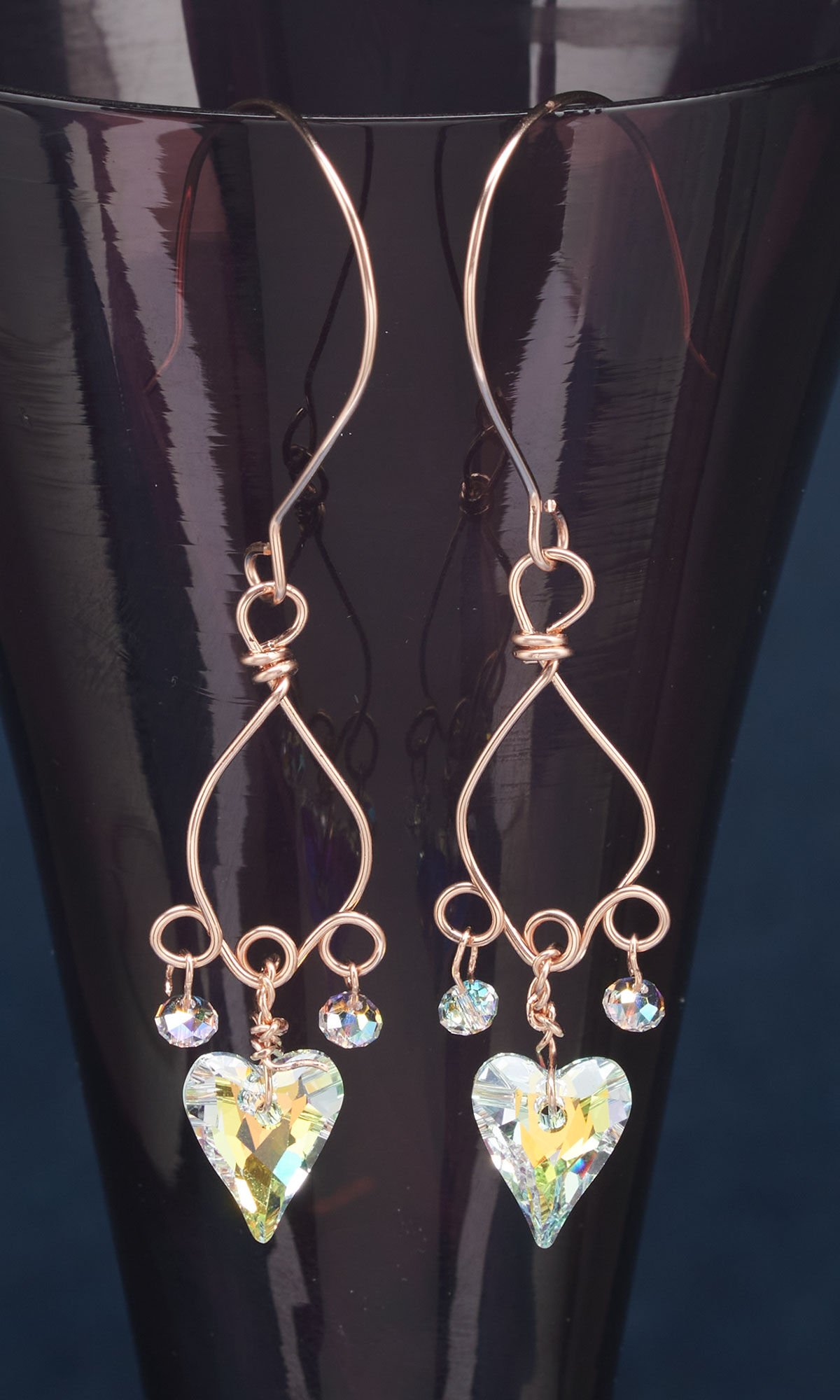 Design Idea Q M 3 7 hanging on a dark purple vase