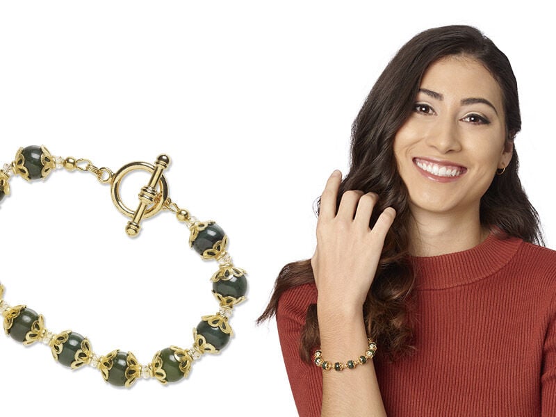 Model wearing a bracelet with gemstones