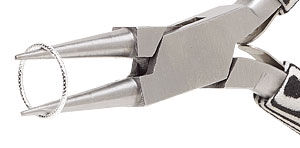 Pliers holding the inside of a jump ring