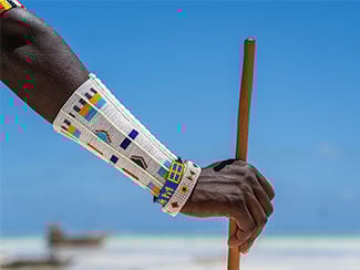 Tribal masai hand with a colorful bracelet, closeup. Zanzibar, Tanzania, Africa