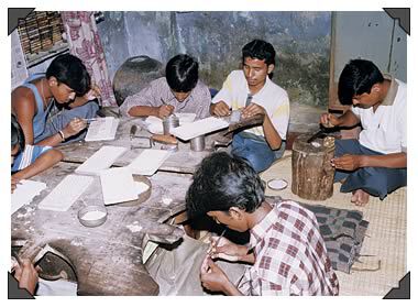 Rajasthan silversmiths creating ornate silver beads in Jaipur.