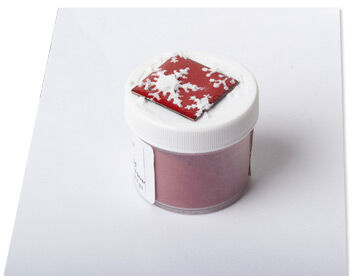 Enameled metal with powdered enamel in a snowflake shape