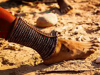 a himba foot with a wide anklet