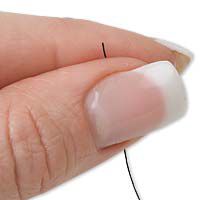 fingers holding thread