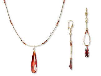An image of a necklace and earrings with cubic zirconia drops