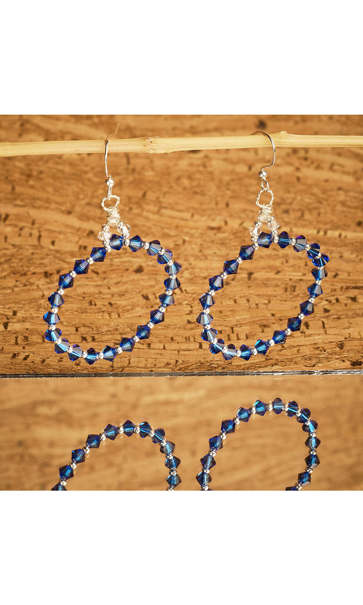 Design Idea R A 2 J earrings on a wooden dowel