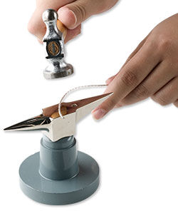 hammering wire on a small anvil