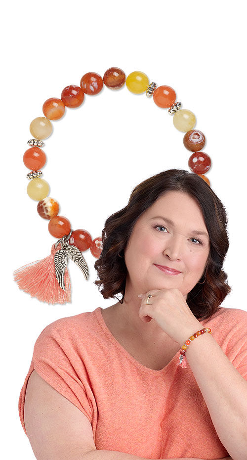 Model wearing a stretch bracelet with gemstone beads
