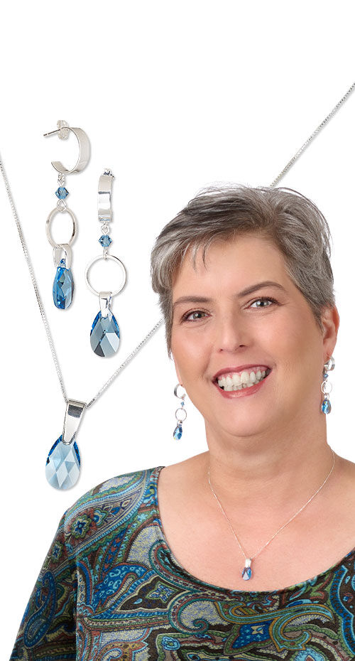 Model wearing necklace and earrings made with crystal passions pendants