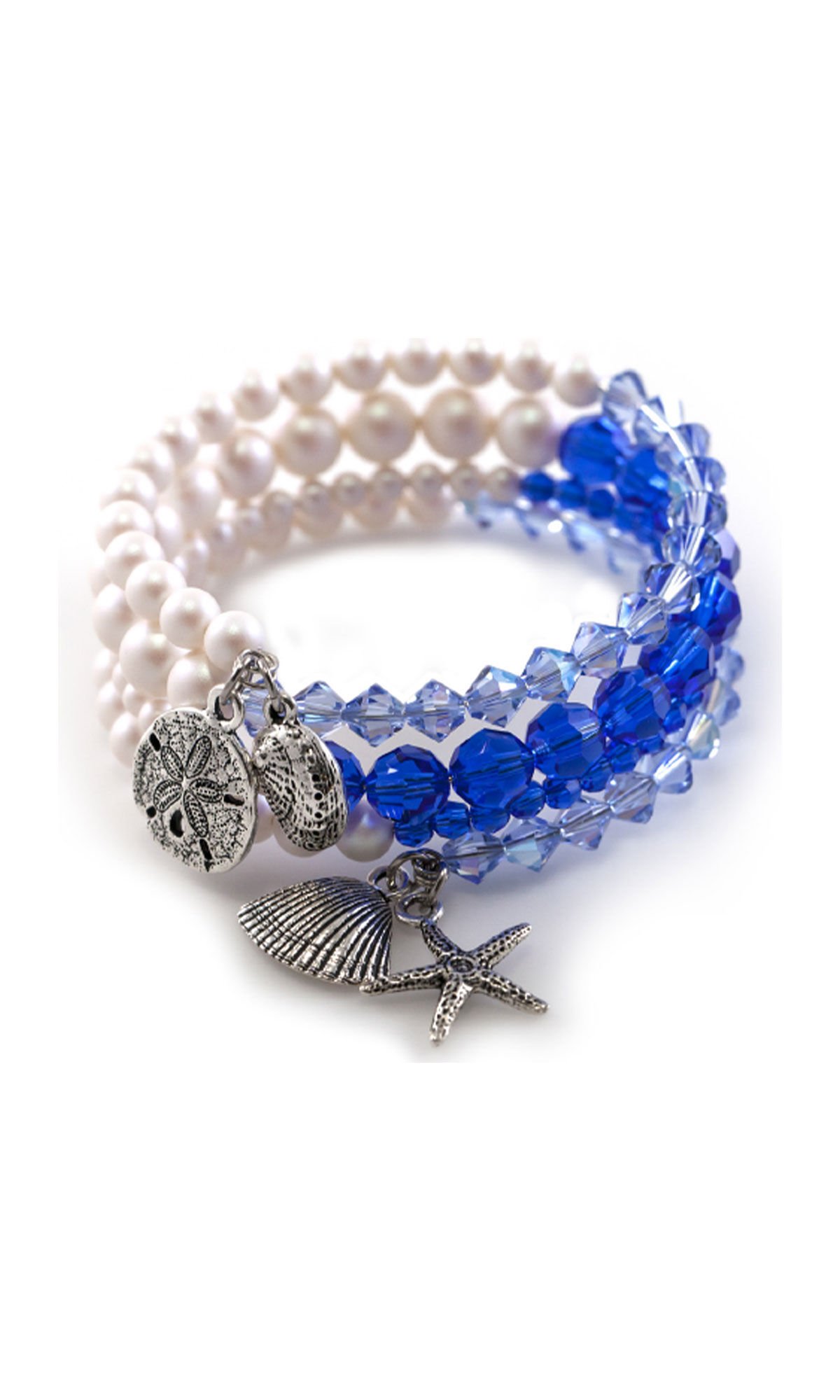 Design Idea R H 3 8 Memory wire bracelet with Crystal Passions&reg; blue bicone beads on the left and white crystal pearls on the right. Four silver charms hang from the end of the bracelet: a starfish, two shells and a sand dollar.