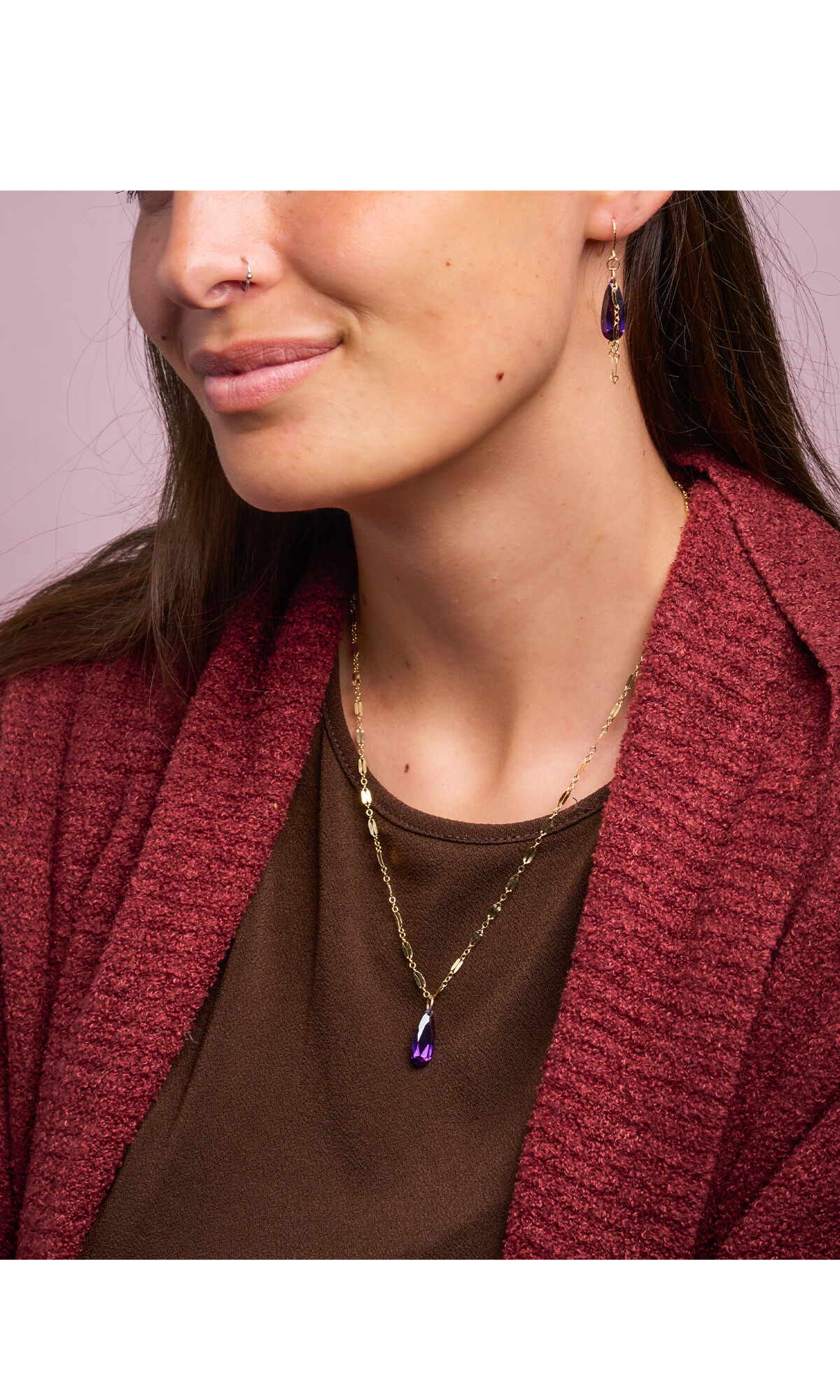 model in red sweater wearing necklace and earring set gold-filled chain and cubic zirconia