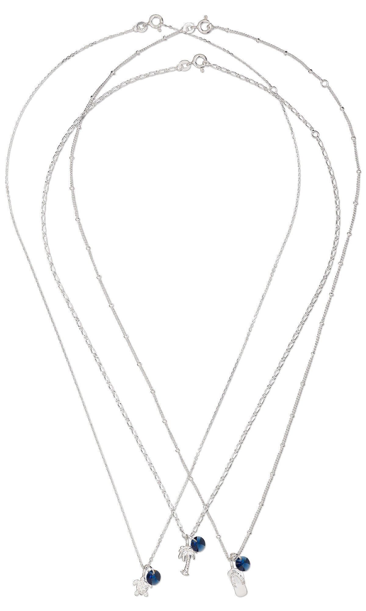Design Idea S A 2 R - Three silver necklaces each have a dark blue round crystal drop and a summer-themed charm&mdash;a turtle, a palm tree and a sandal.