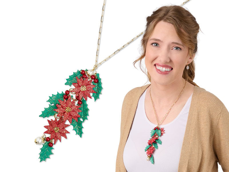 A model wearing a chain necklace with a handmade polymer pendant