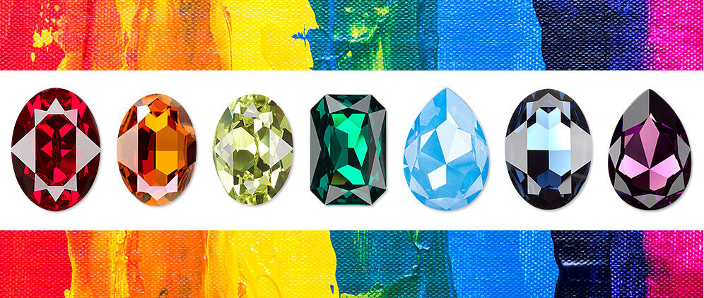 Multicolored crystals on rainbow-painted background