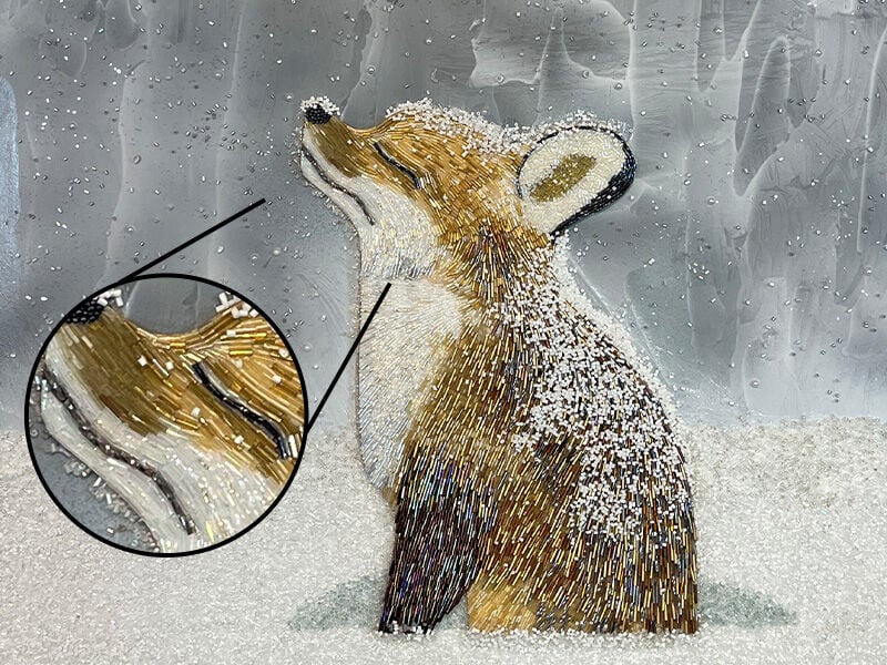 bead mosaic showing a fox in snow