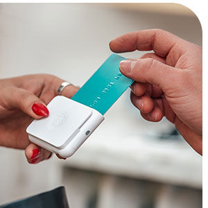 A credit card being inserted into a card reader