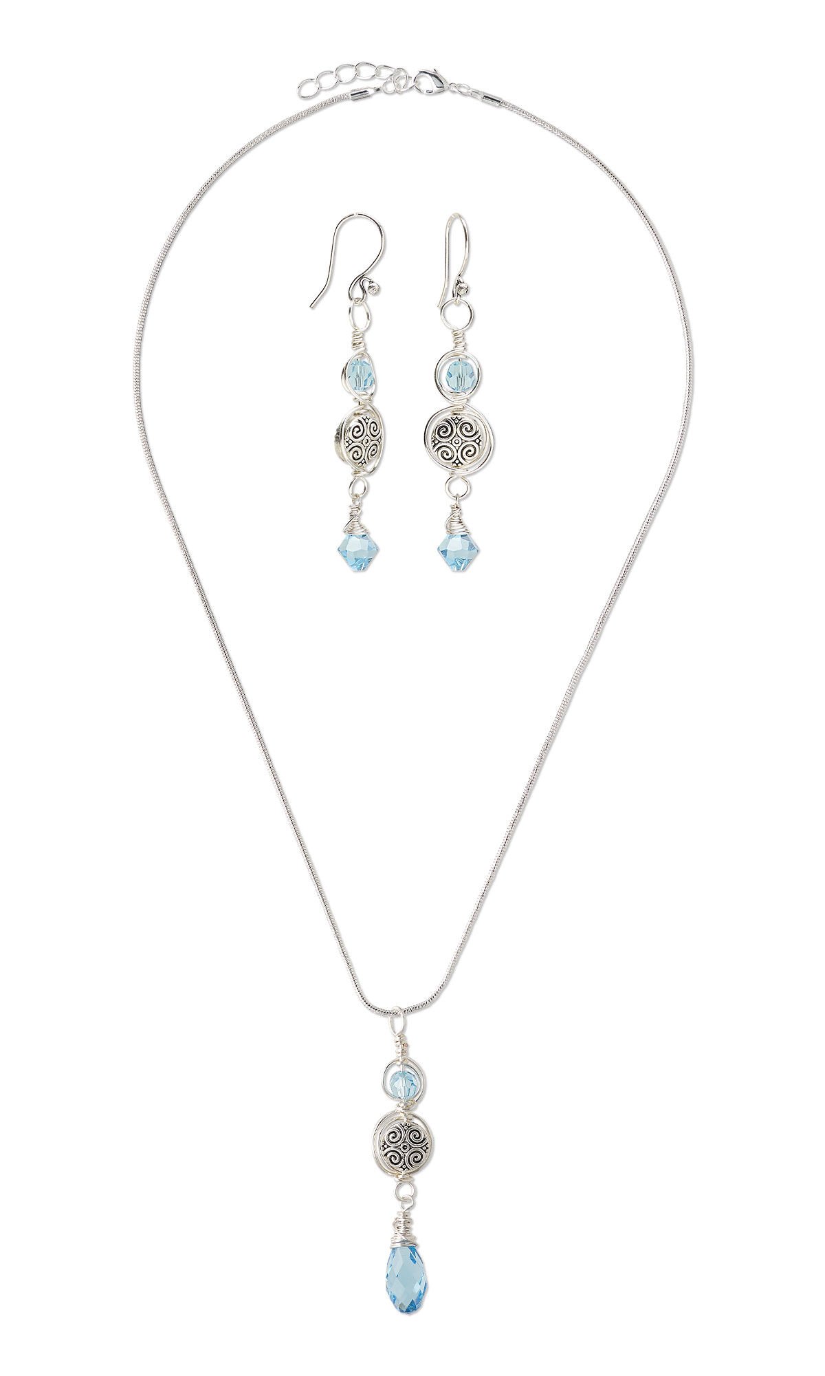 Design Idea R N 2 J - Necklace has sleek silver chain with a drop featuring wire spiraling around an aquamarine-colored crystal bead and a textured silver bead and an aquamarine-colored crystal briolette drop. Fishhook earrings feature similar drops.