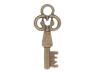 Brass-colored key with large teeth facing left and the top of the key pointed to the right. The top of the key is swirly.
