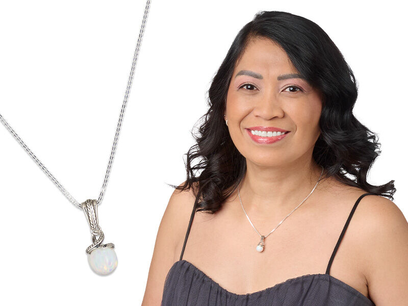 Model wearing a necklace with an opal focal