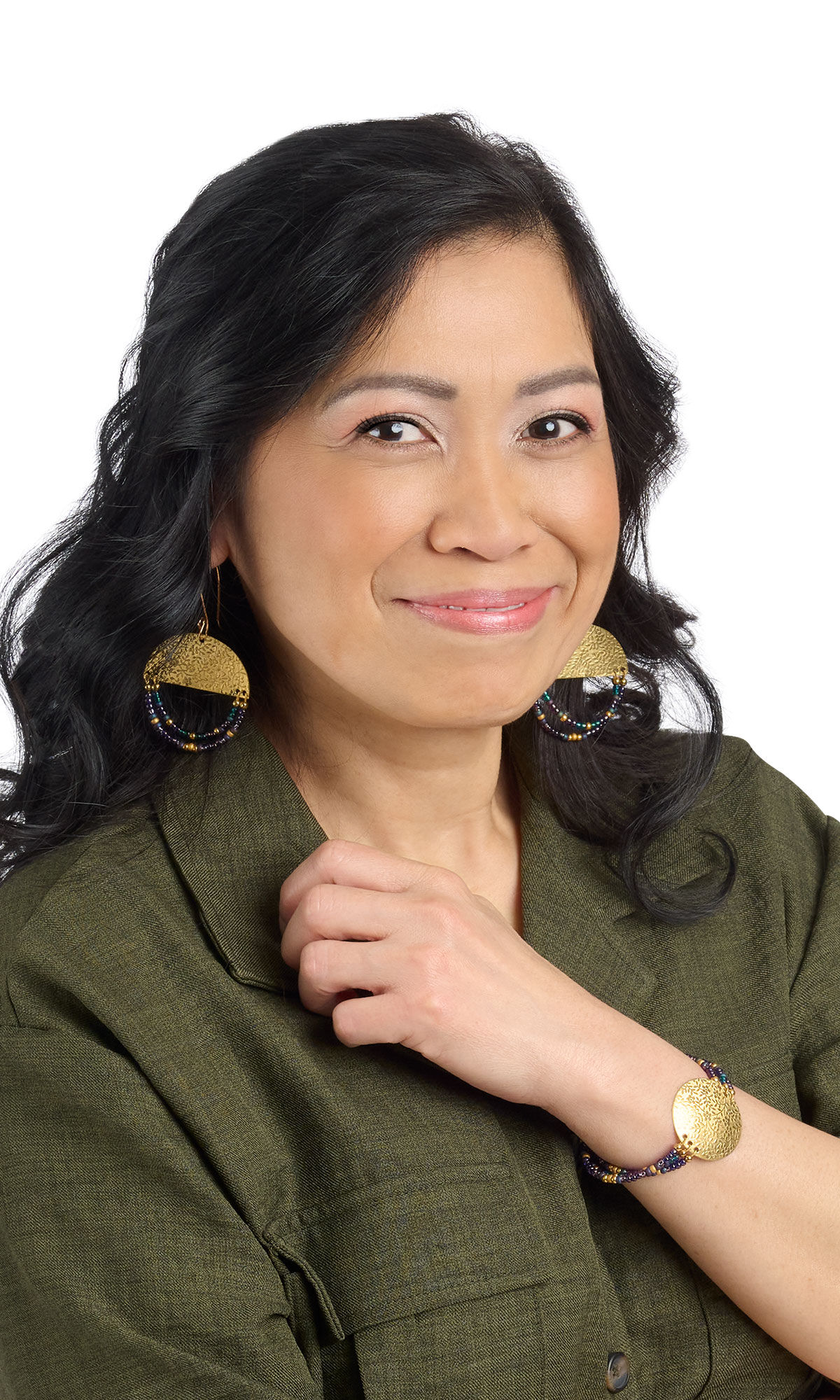 A woman in green wearing design Idea P H 2 7